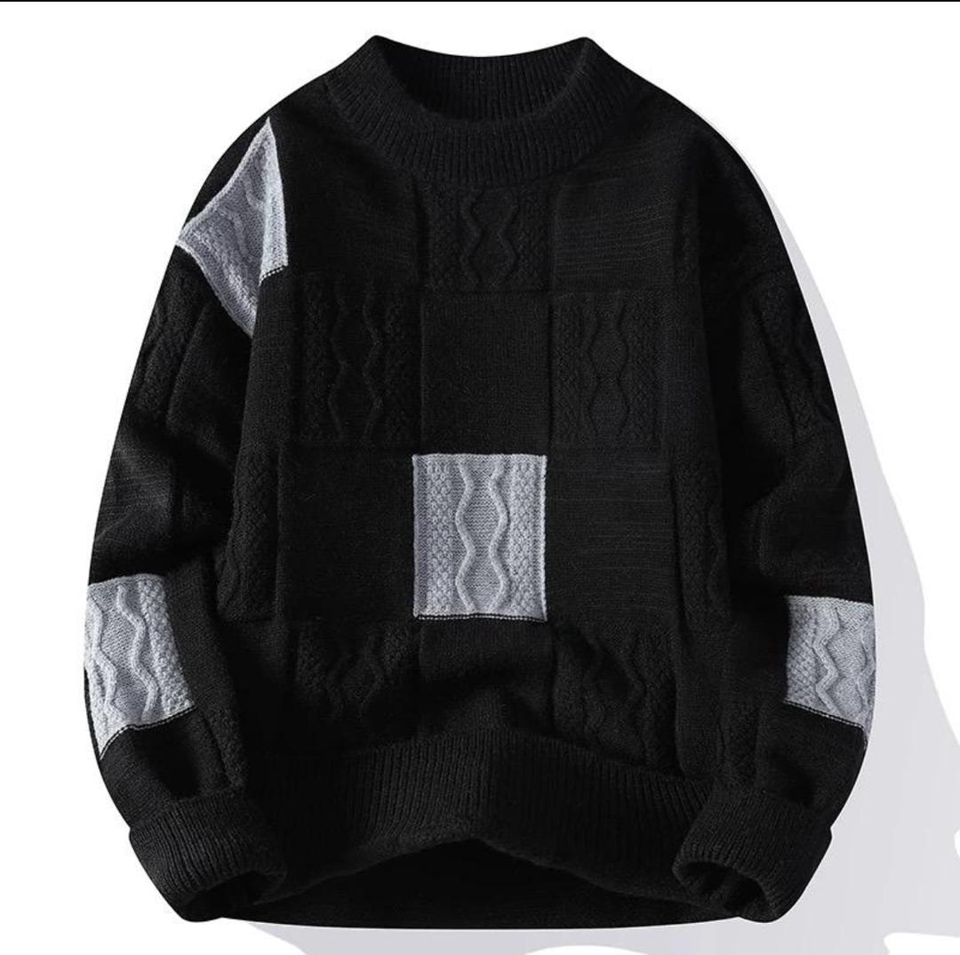 Black knit sweatshirt with gray cable knit patchwork panels.