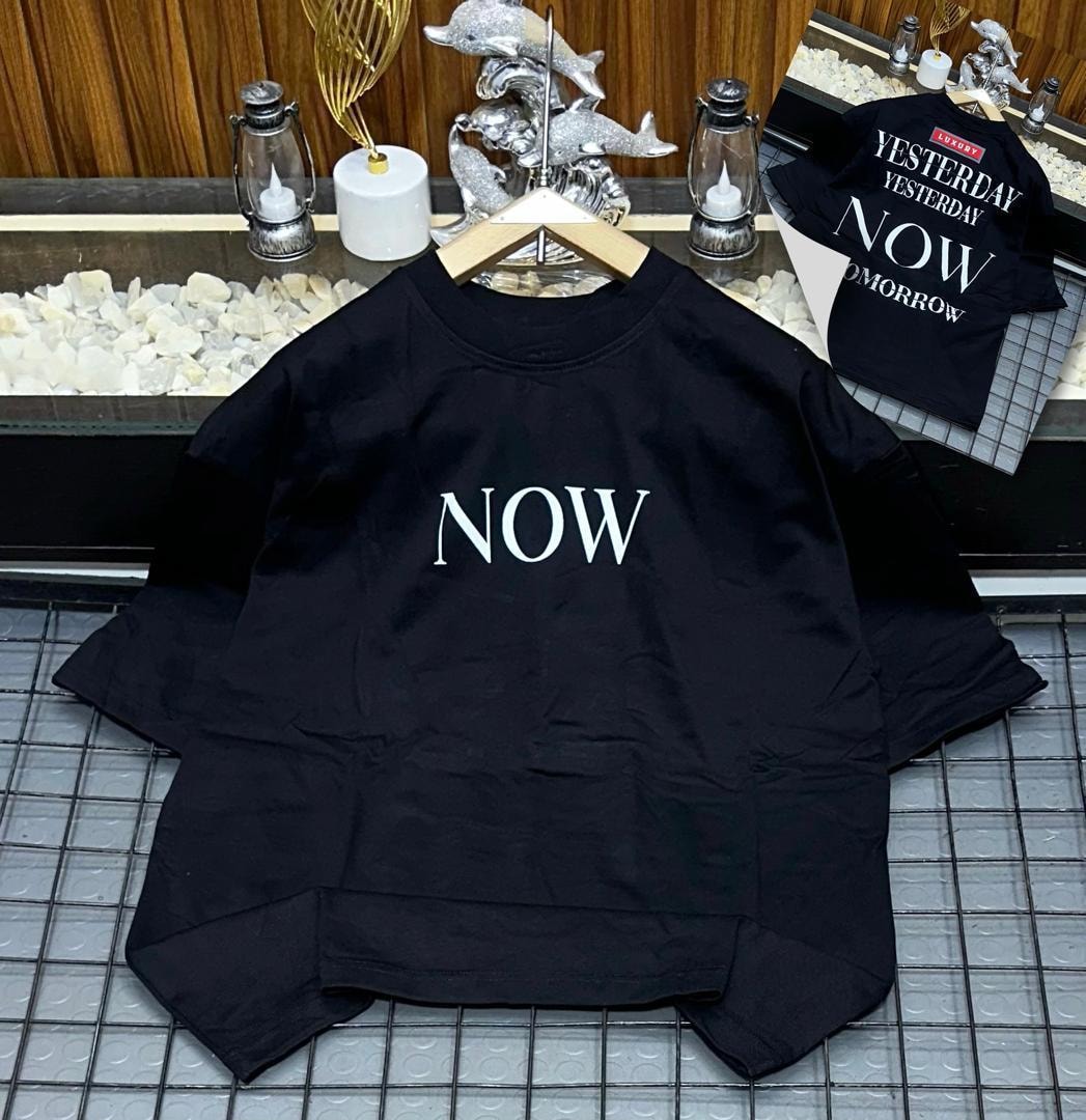 Black oversized t-shirt with large NOW text and back design inset.