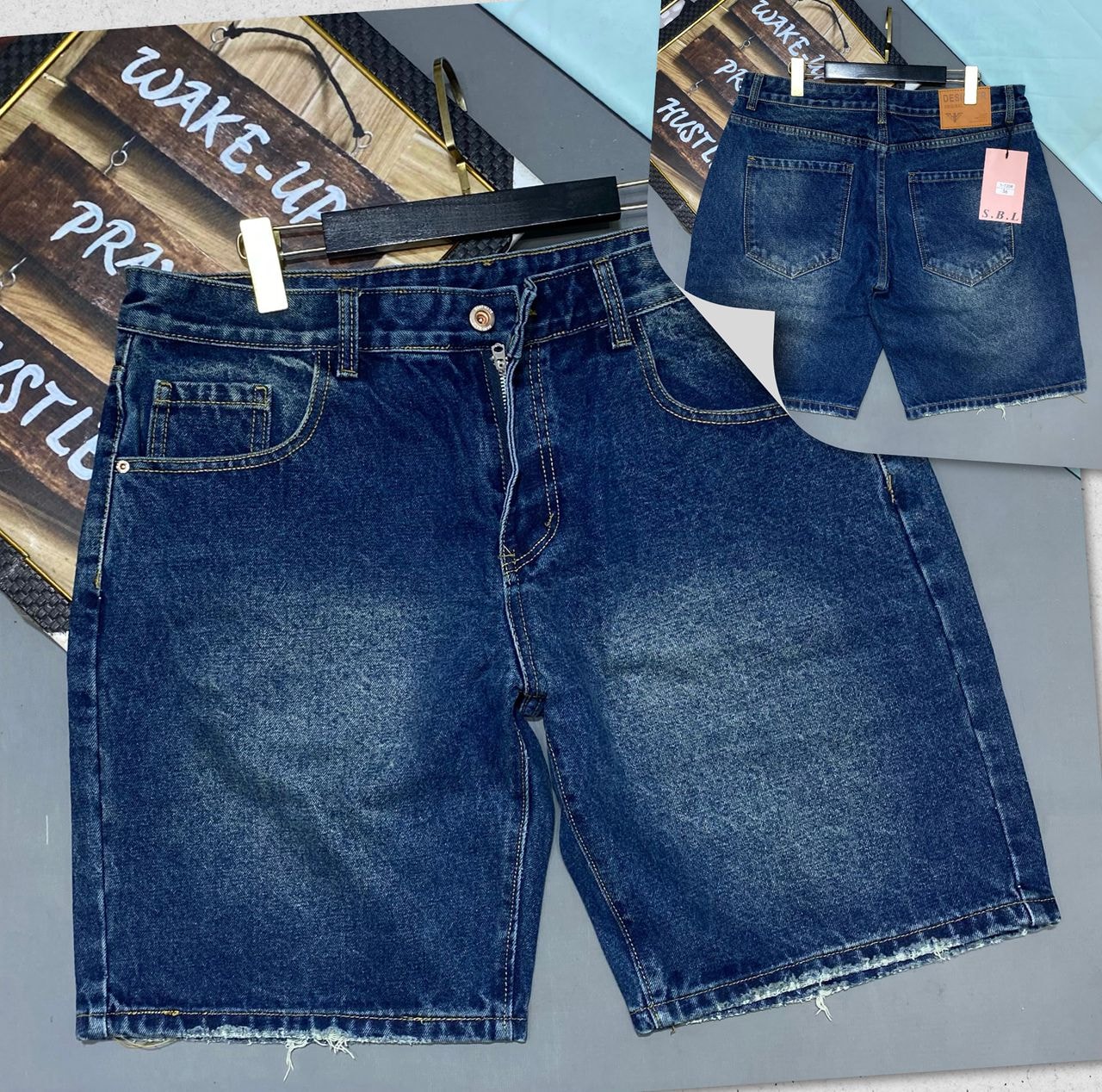 Front and back views of faded blue denim jorts with raw hems and classic pockets.