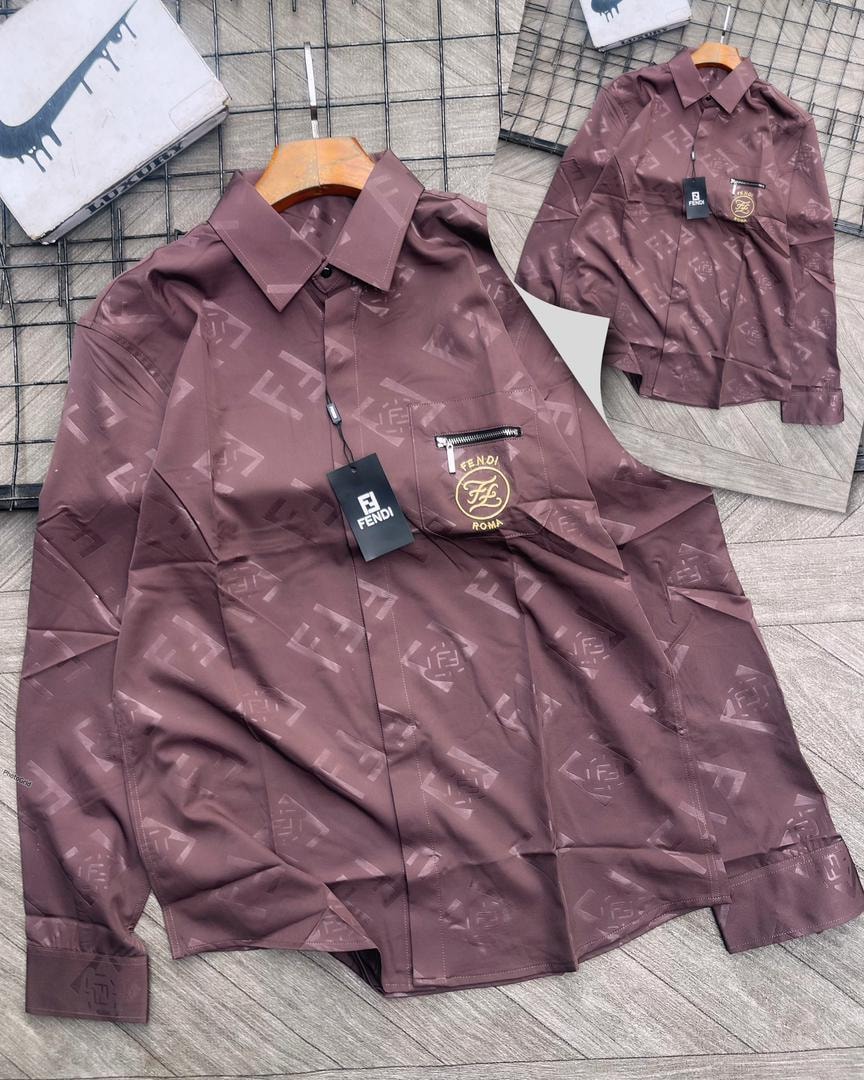 Burgundy Fendi monogram print long sleeve shirt with chest pocket and logo.