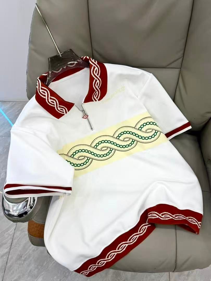 White Casablanca polo shirt with red trim and green chain embroidery.