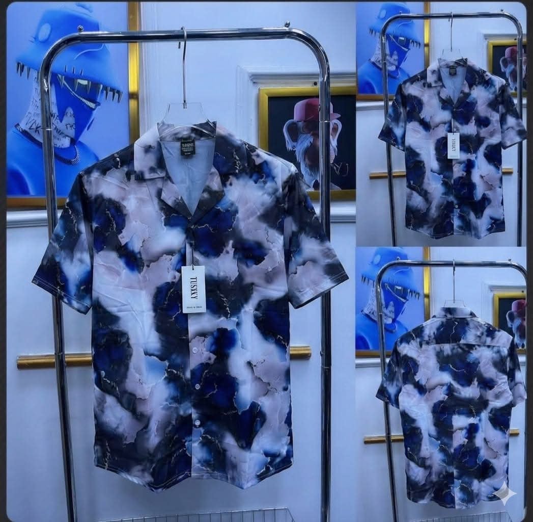 Short sleeve shirt with blue black white abstract marble cloud print shown in multiple views.