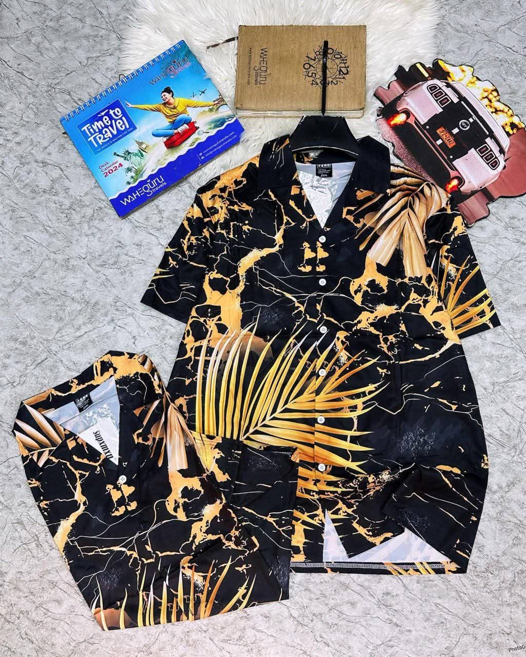 Short sleeve shirt with black gold marble and palm leaf print.