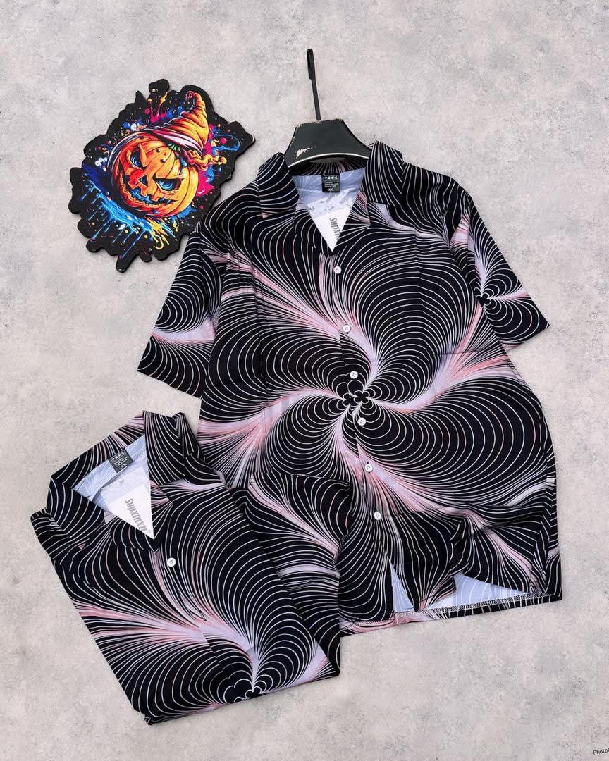 Short sleeve shirt with black base and pink white swirling vortex all-over print.