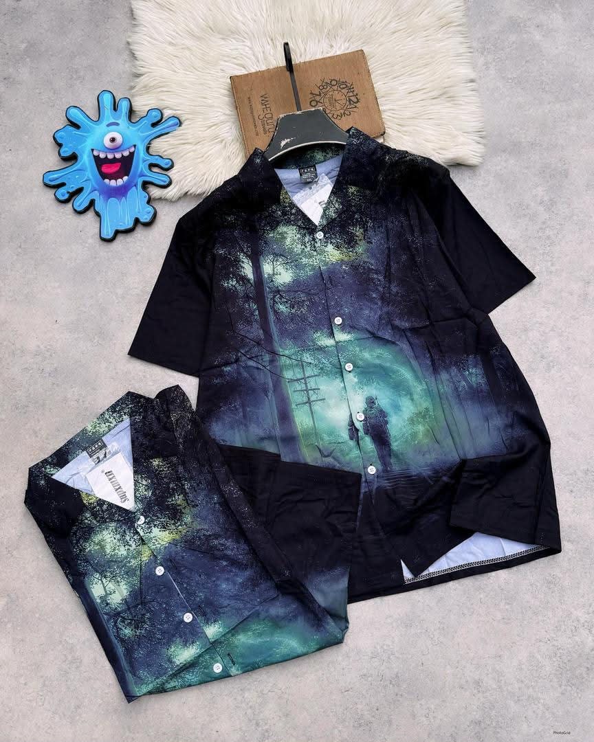 Short sleeve shirt with all-over misty forest and figure graphic print in dark tones.