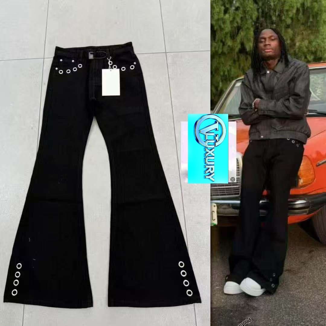 Black baggy jeans flat lay beside model wearing the same black eyelet design.