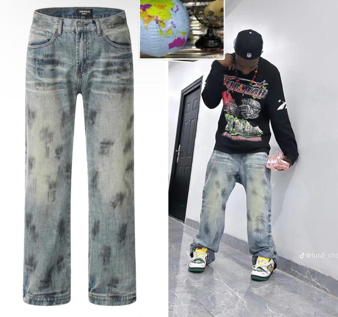 Acid wash baggy jeans flat lay and on model wearing with black sweatshirt.