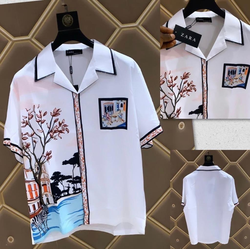 White ZARA short sleeve shirt with scenic tree building and zebra print, multiple views.