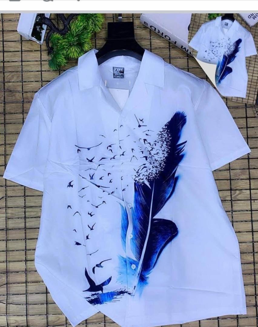 White short sleeve shirt with blue feather birds and flock print.