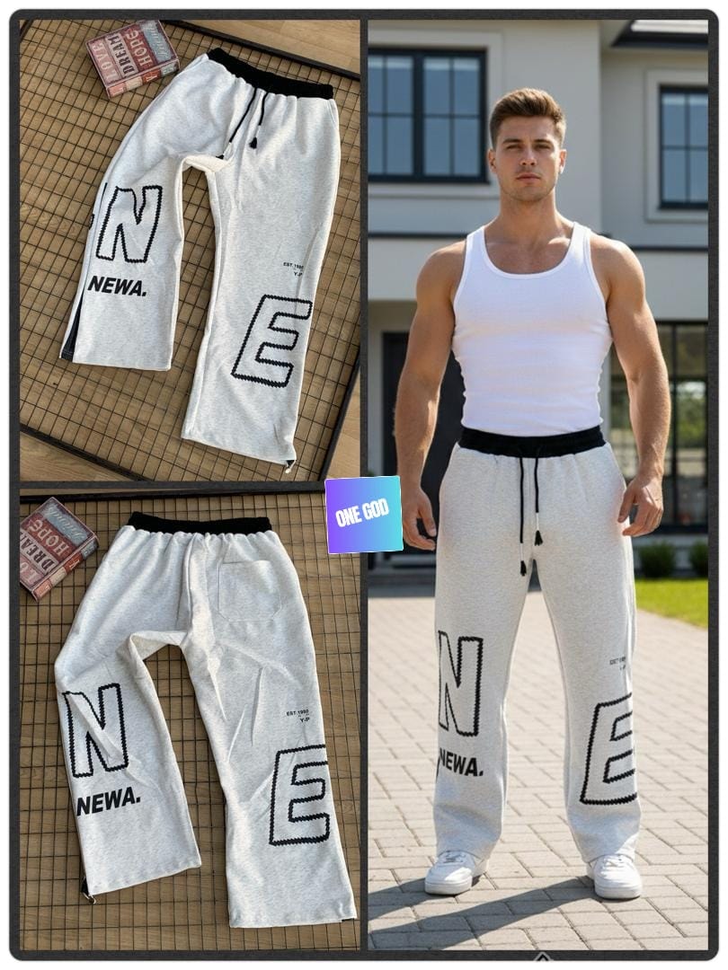 Light gray joggers with large NEWA and E graphics shown in flat lay and on model.