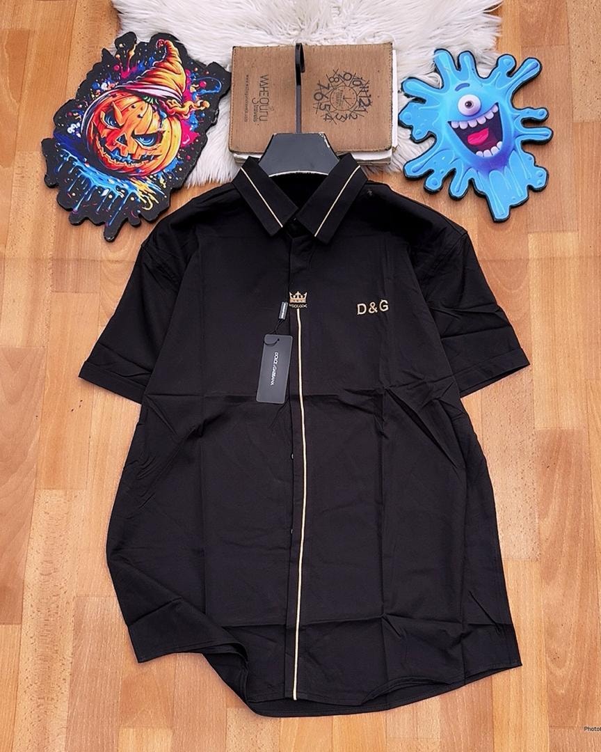 Black D&G short sleeve shirt with gold piping.