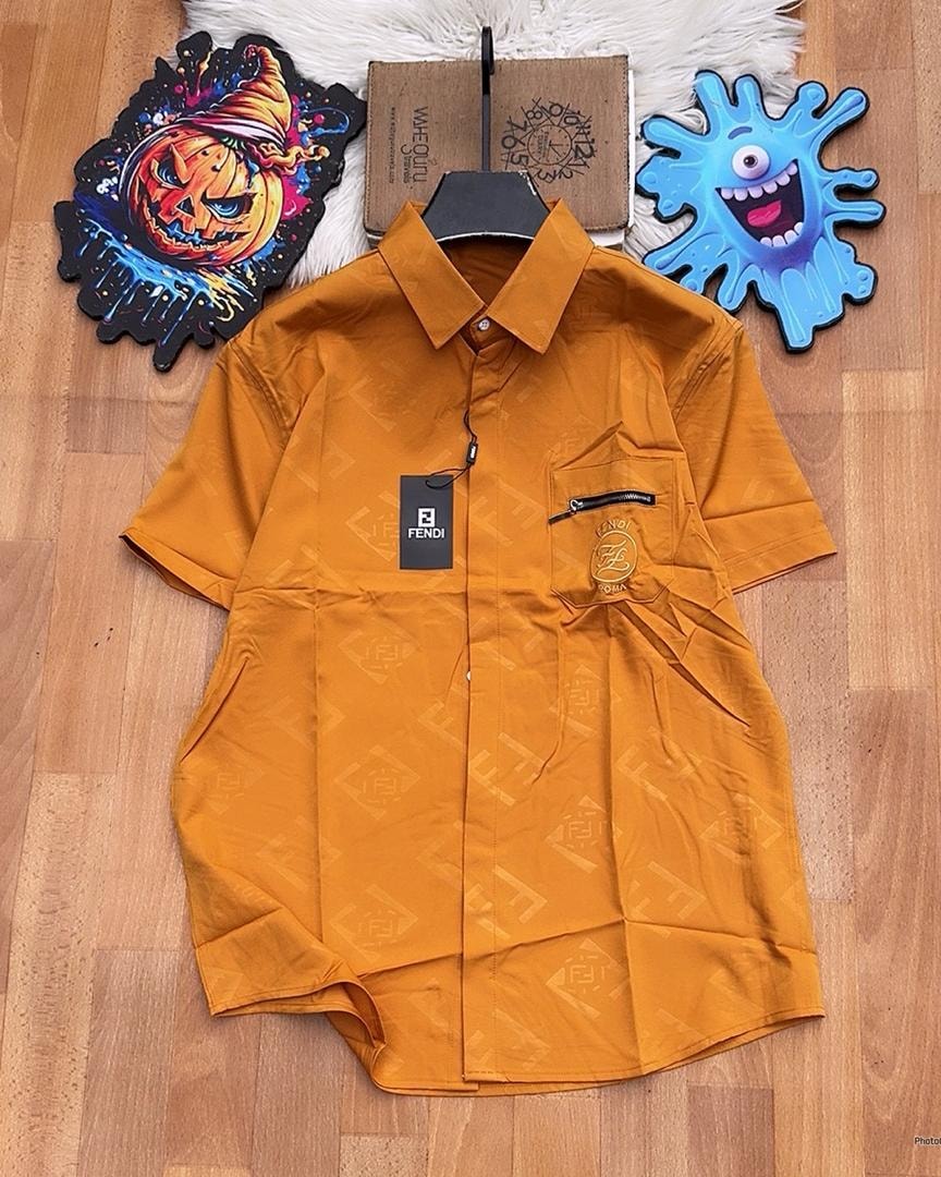 Orange Fendi monogram short sleeve button-down shirt laid flat.