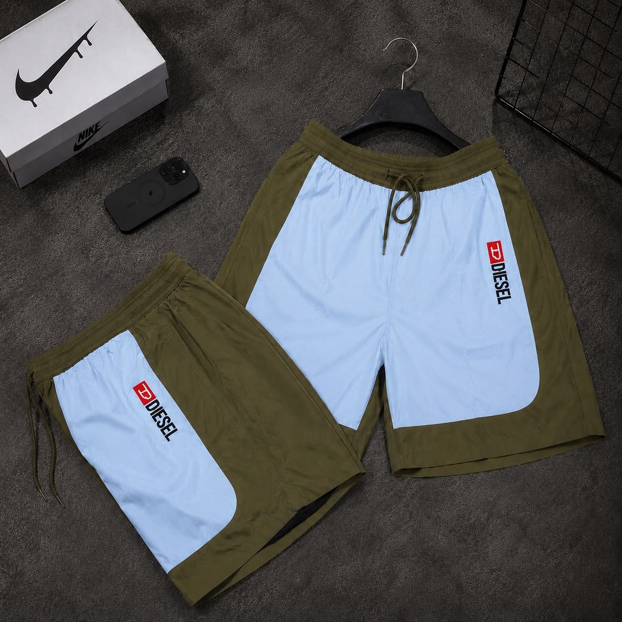 Olive and light blue colorblock cargo shorts with Diesel logo in two variations.