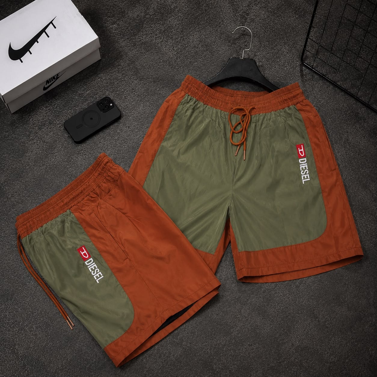 Orange and olive colorblock cargo shorts with Diesel logo in two styles.
