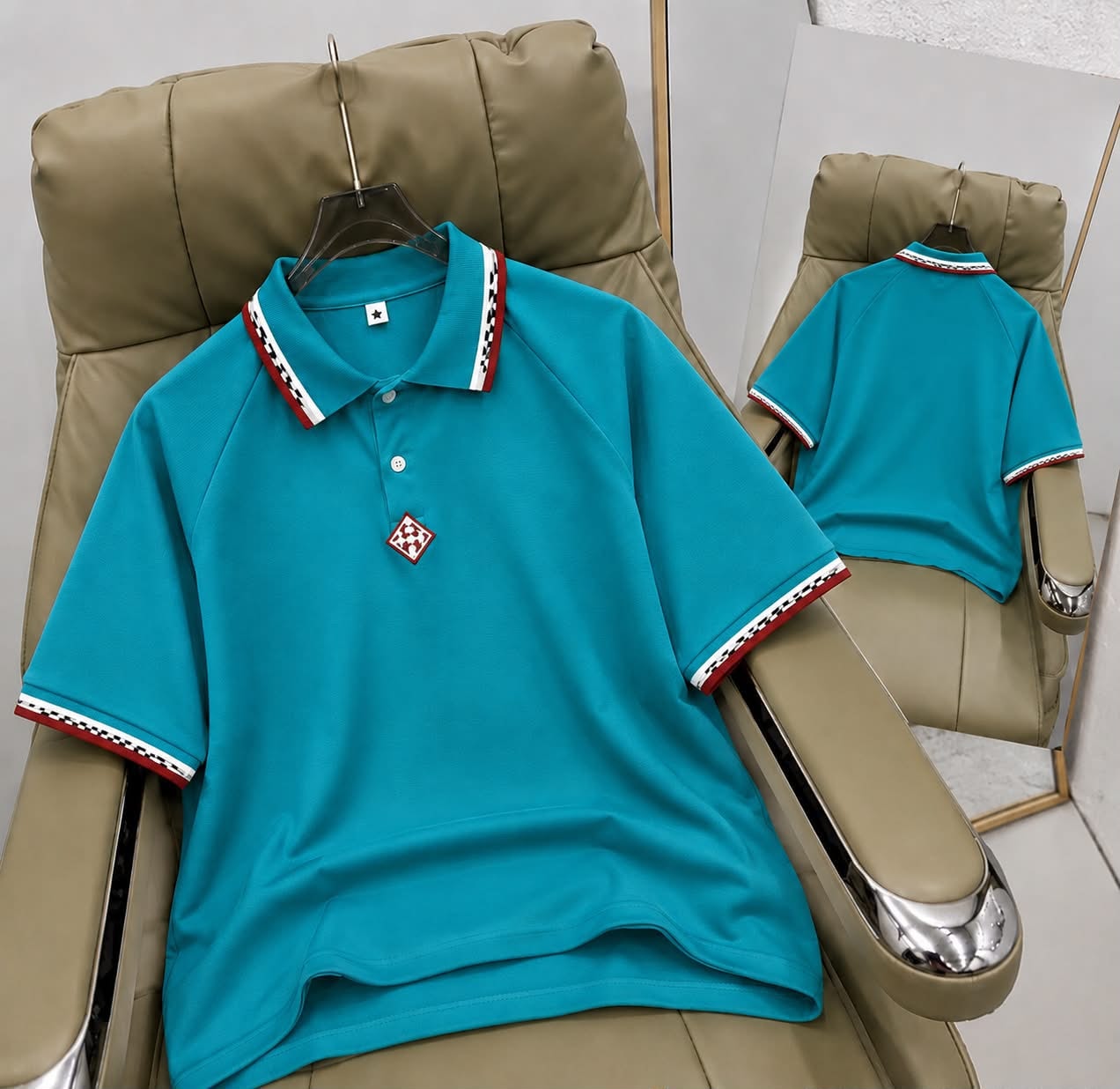 Turquoise short sleeve polo shirt with patterned trim on collar and cuffs, front and back views.
