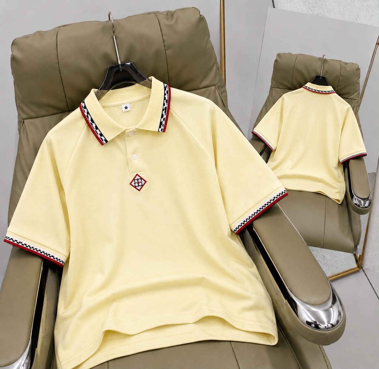 Yellow short sleeve polo shirt with patterned trim on collar and cuffs, front and back views.