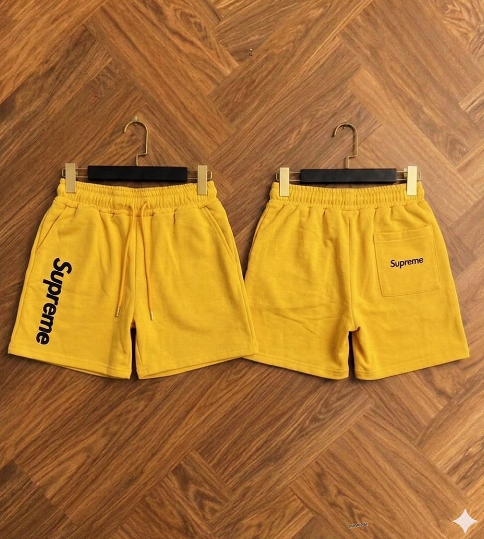 Yellow Supreme fleece shorts shown from front and back views.