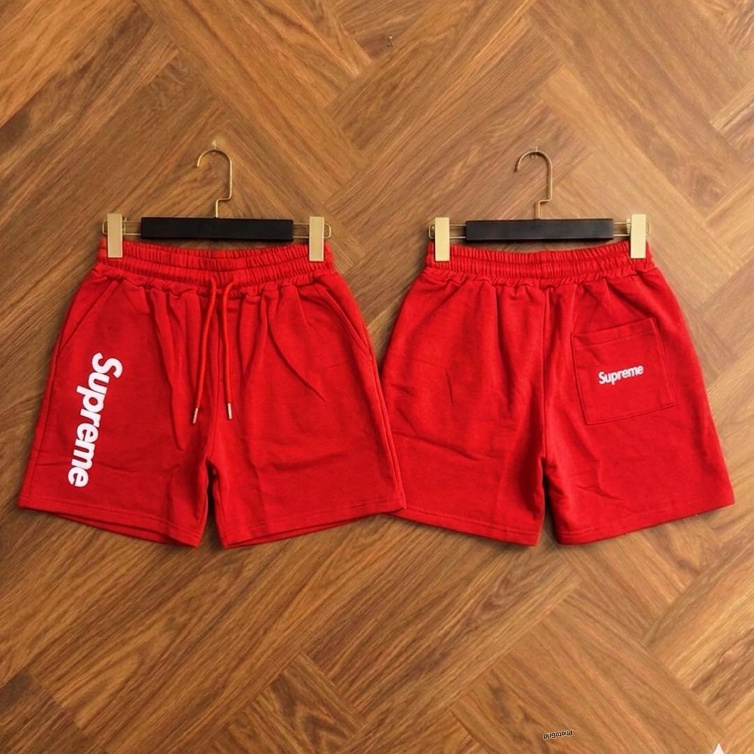 Red Supreme fleece shorts shown from front and back views.