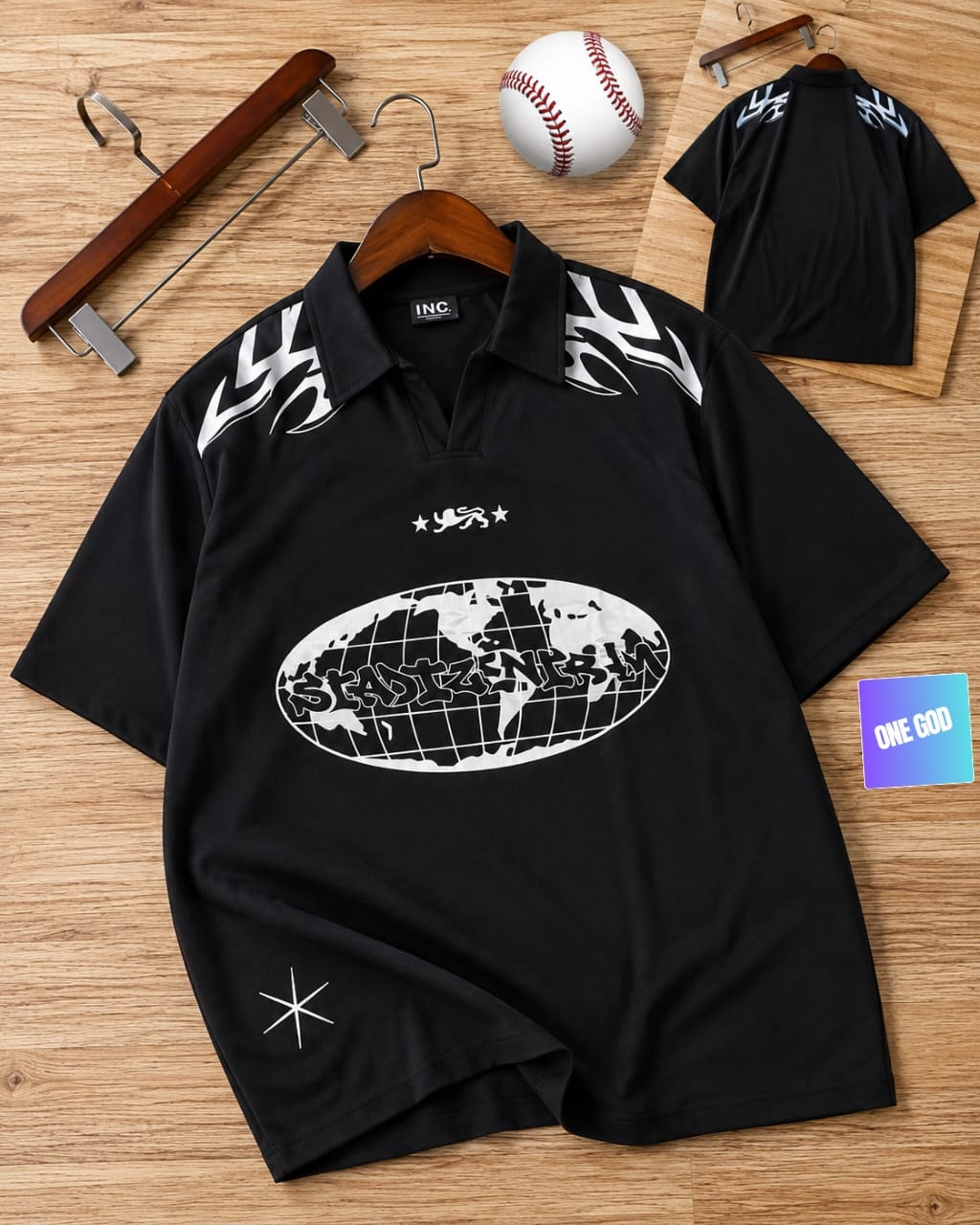 Black short sleeve polo with white flame, globe and star graphics, shown with back view.