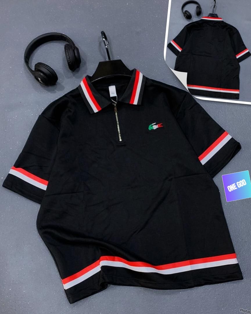 Black polo shirt with red white striped trim and zip closure.