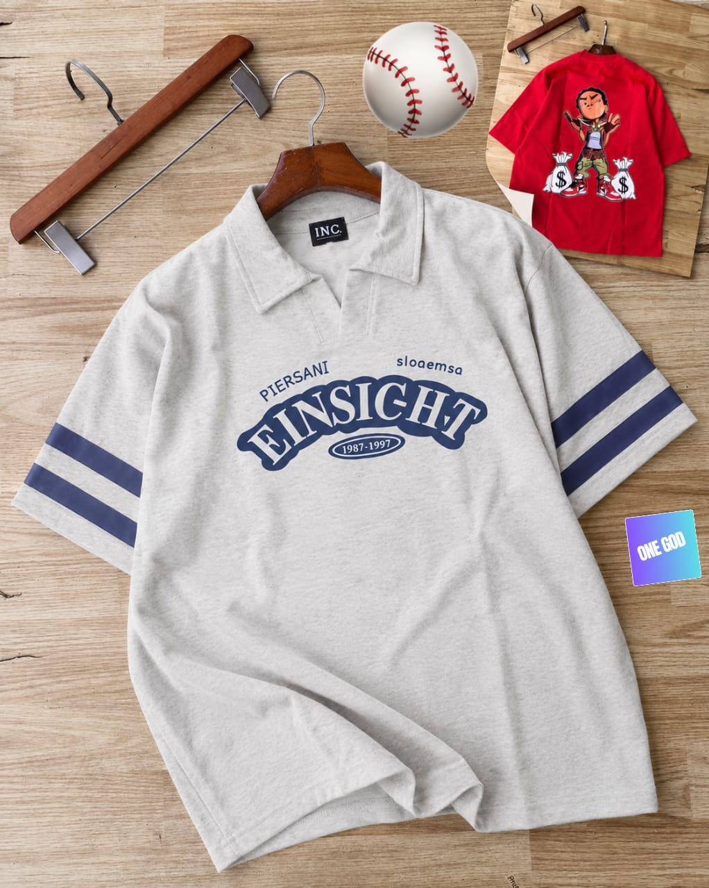 Light gray polo shirt with Einsicht graphic and striped sleeves.