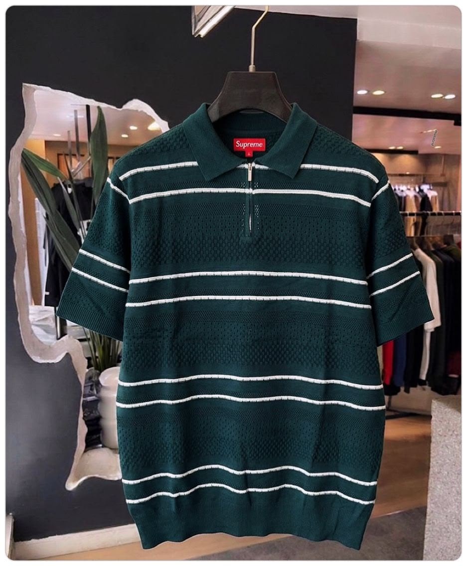 Green with white stripes Supreme mesh knit polo shirt on hanger.