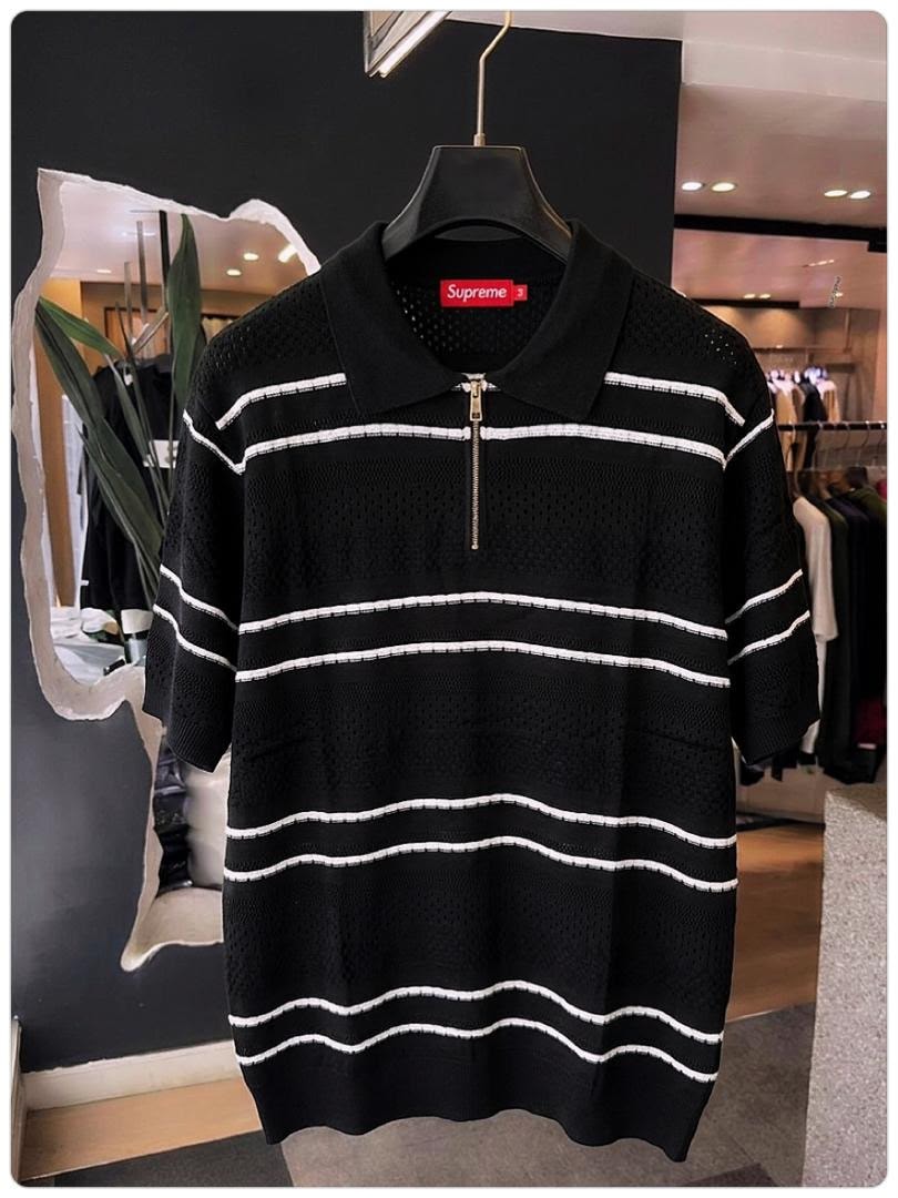 Black with white stripes Supreme mesh knit polo shirt on hanger.