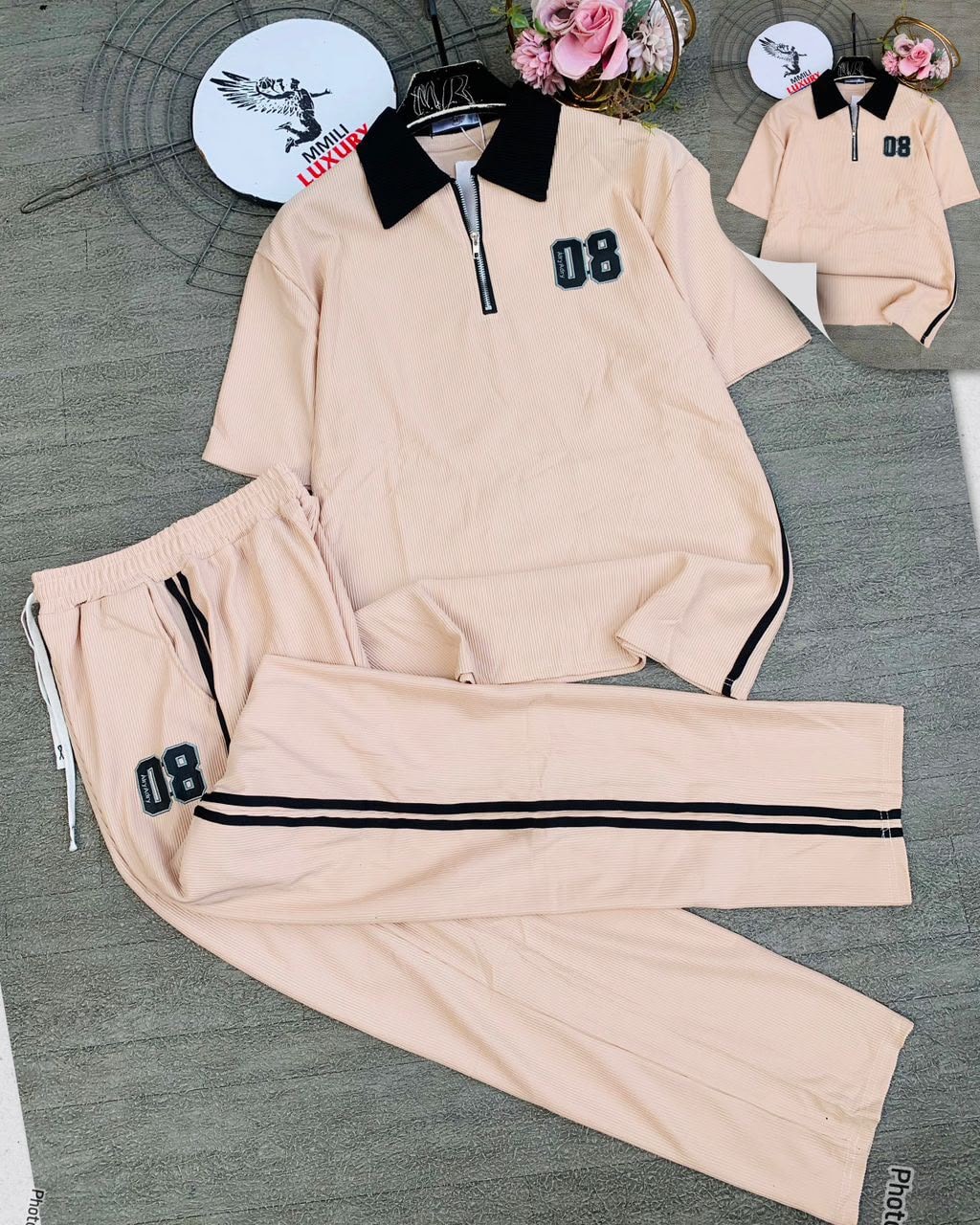 Peach beige ribbed polo and jogger two-piece set in flat lay view.