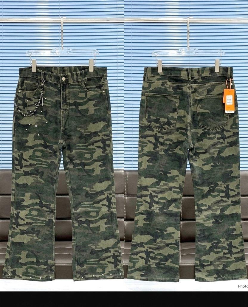 Front and back views of green camouflage flared jeans with chain and stud details.