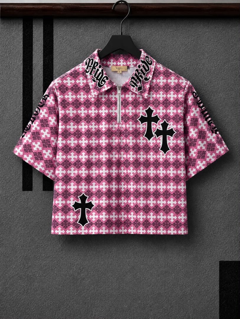 Pink polo shirt with all-over cross pattern and Pride text on collar.