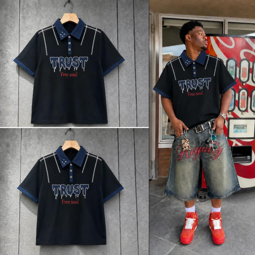 Black polo shirt with Trust Free Soul print shown flat and on model with denim shorts.