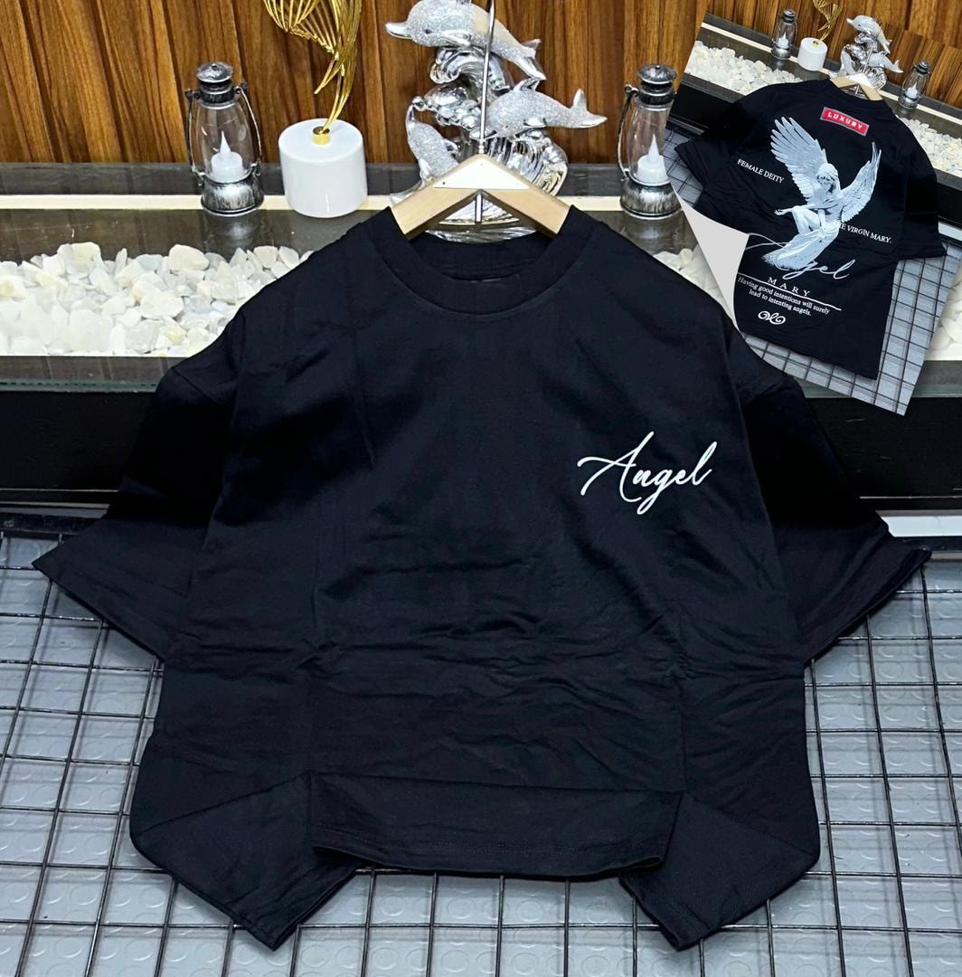 Black oversized t-shirt with white 'Angel' script on chest and detailed angel graphic on back inset.