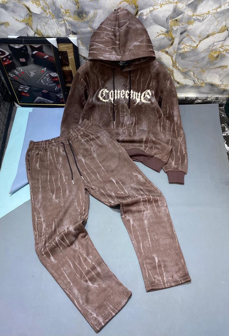 Brown tie-dye hoodie and joggers with white gothic text print.