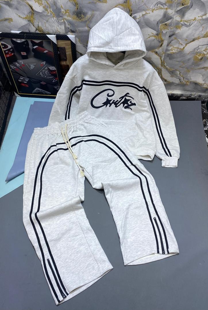 Light gray hoodie and joggers with black stripes and script print.