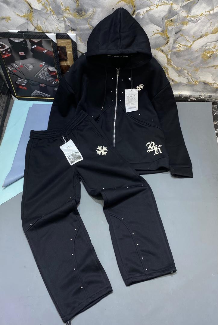 Black studded zip hoodie and jogger set with cross emblems and embroidery.