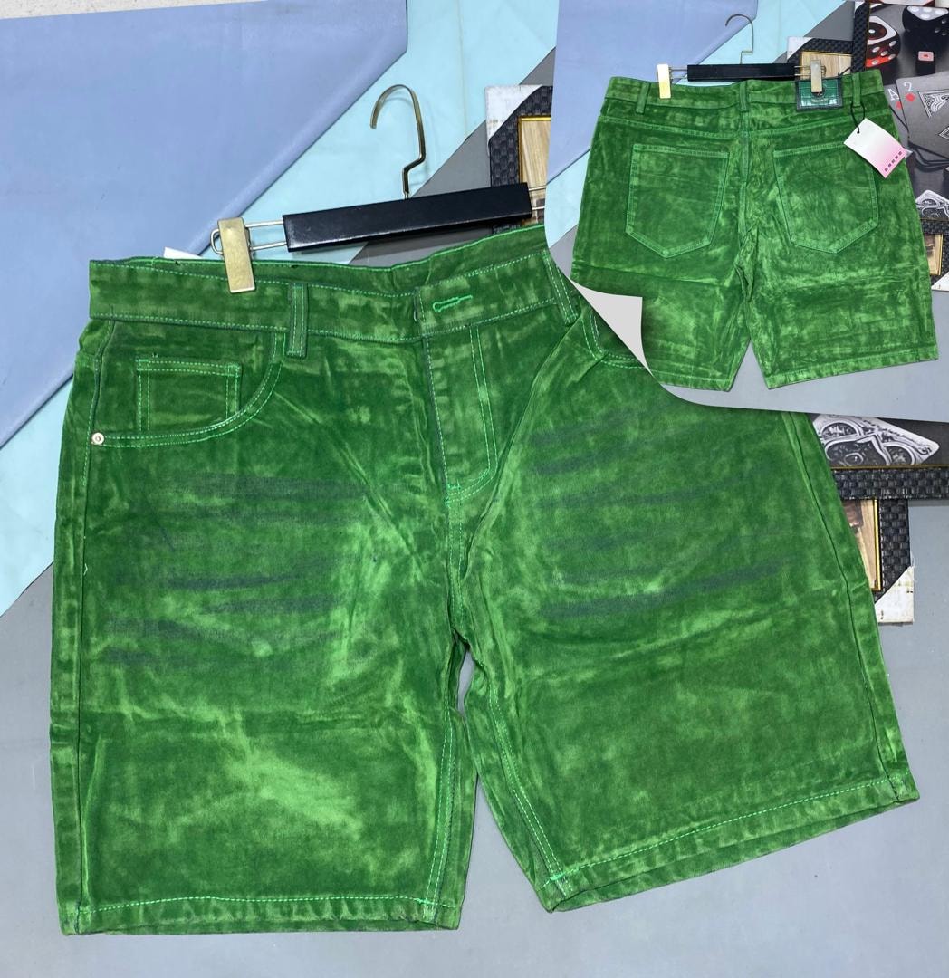 Green corduroy shorts shown in front and back views on hanger.