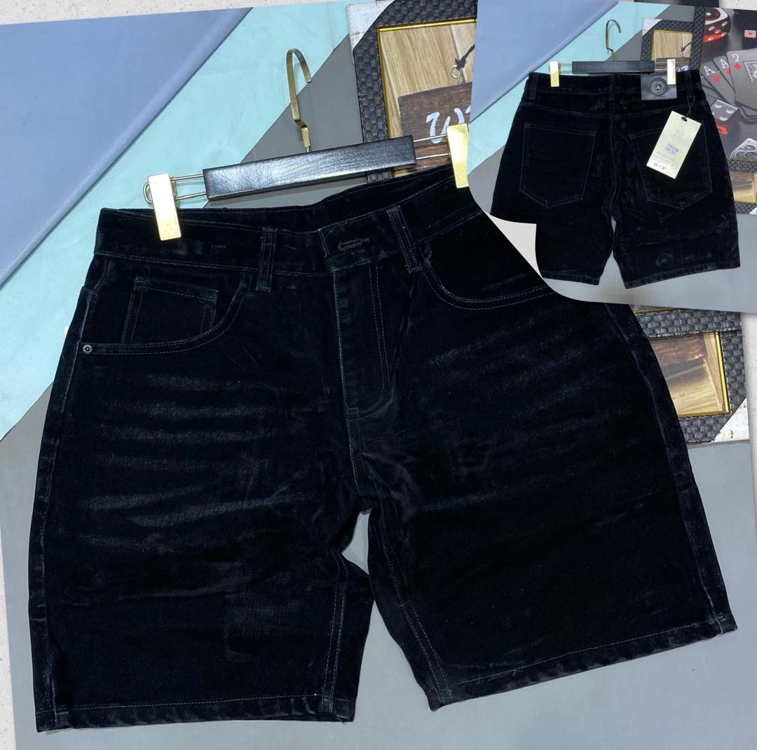 Black corduroy shorts shown in front and back views on hanger.