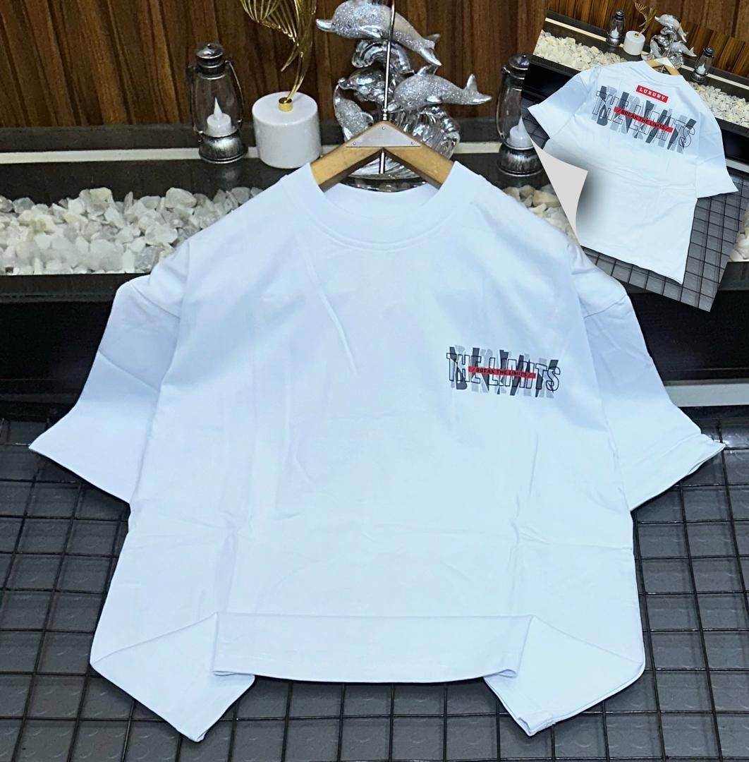 White oversized t-shirt with Break The Limits graphic on chest and back inset.