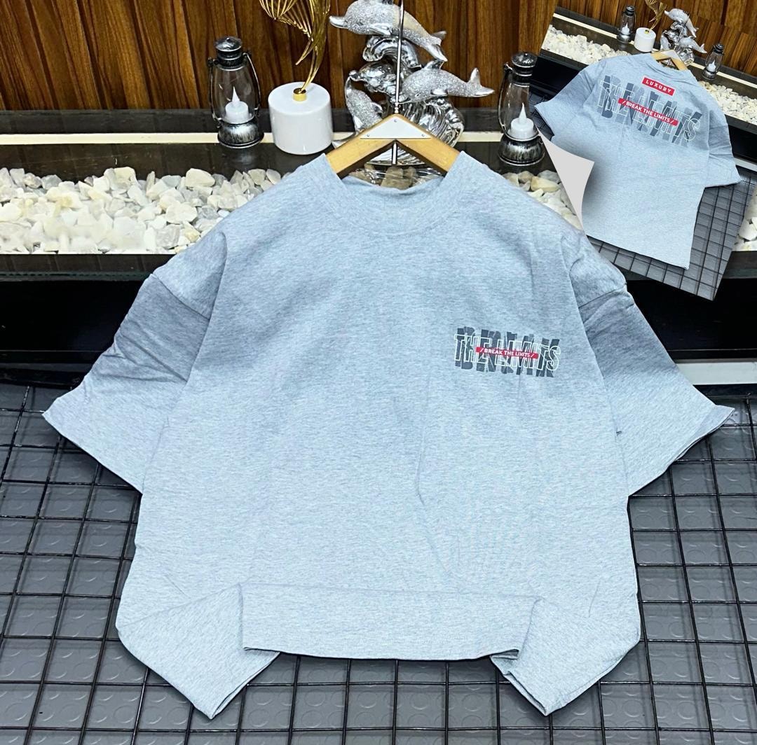 Light gray oversized t-shirt with Break The Limits graphic on chest and back inset.