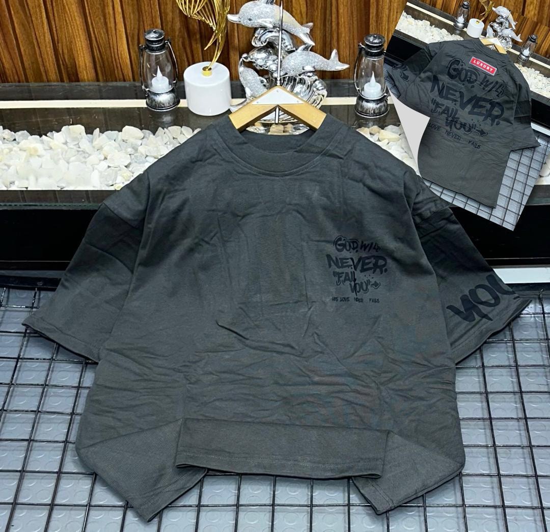 Green oversized t-shirt with God Will Never Fail You text print on chest, sleeve and back inset.