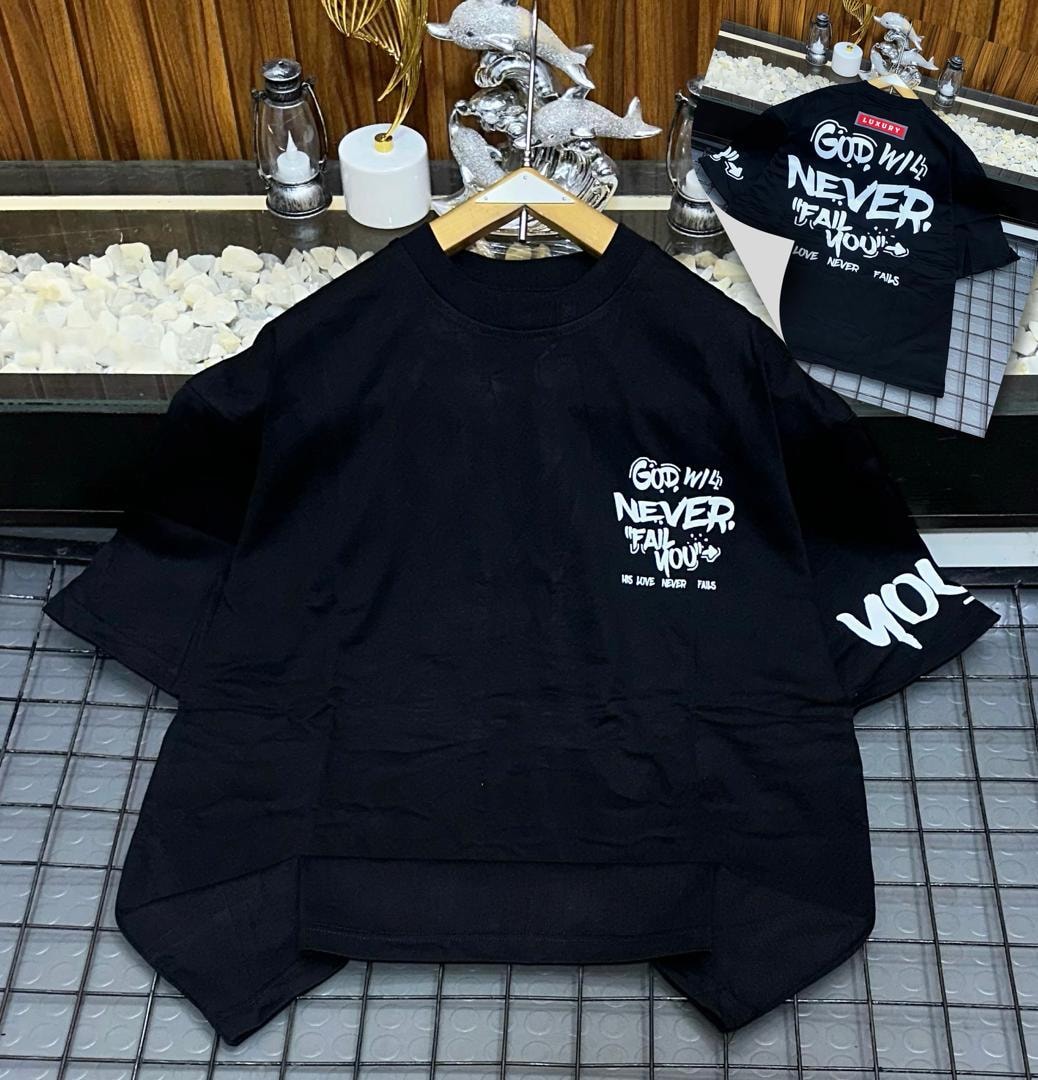 Black oversized t-shirt with God Will Never Fail You text print on chest, sleeve and back inset.