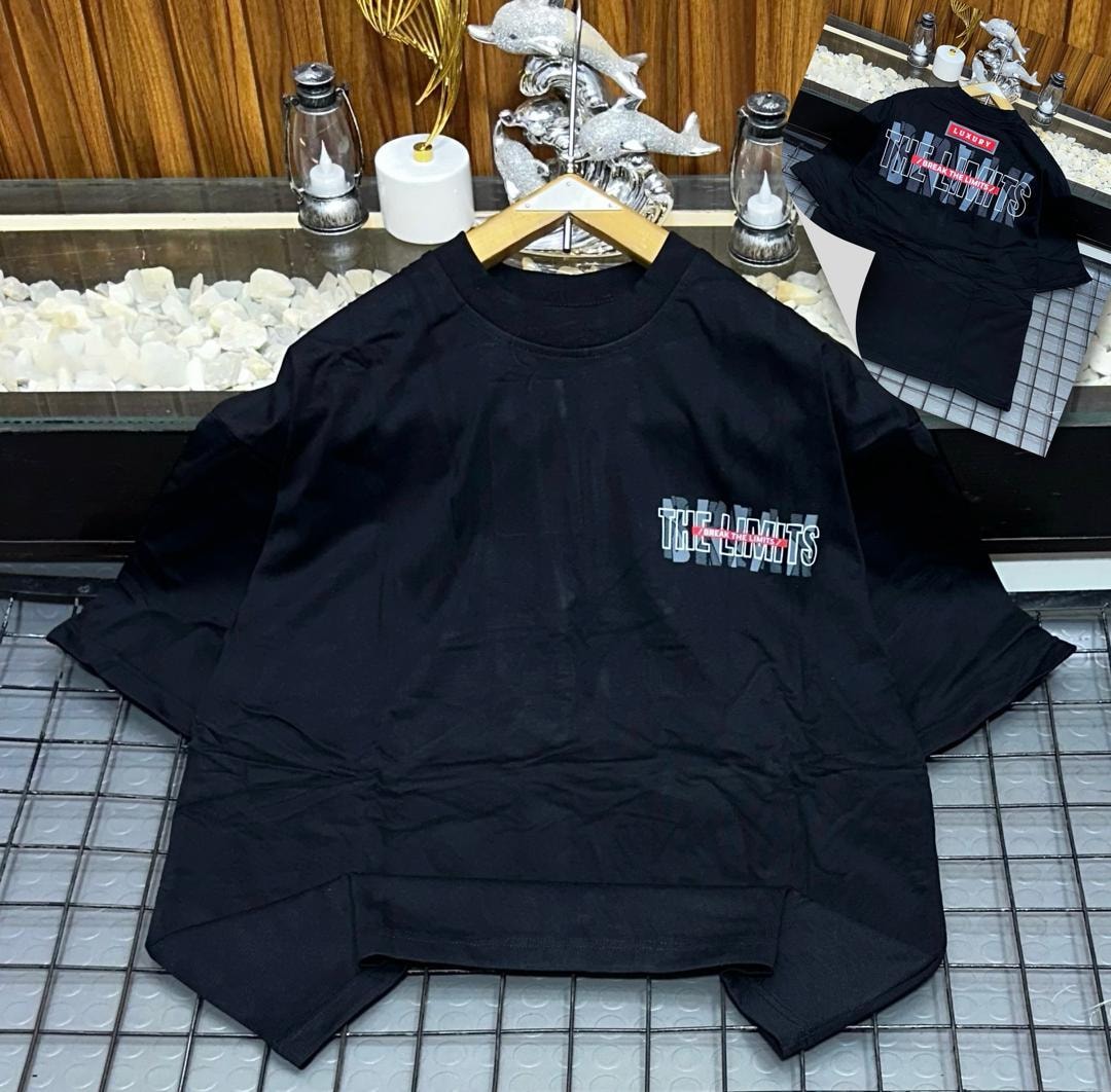 Black oversized t-shirt with Break The Limits graphic on chest and back inset.