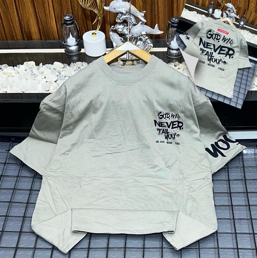 Olive oversized t-shirt with God Will Never Fail You text print on chest, sleeve and back inset.