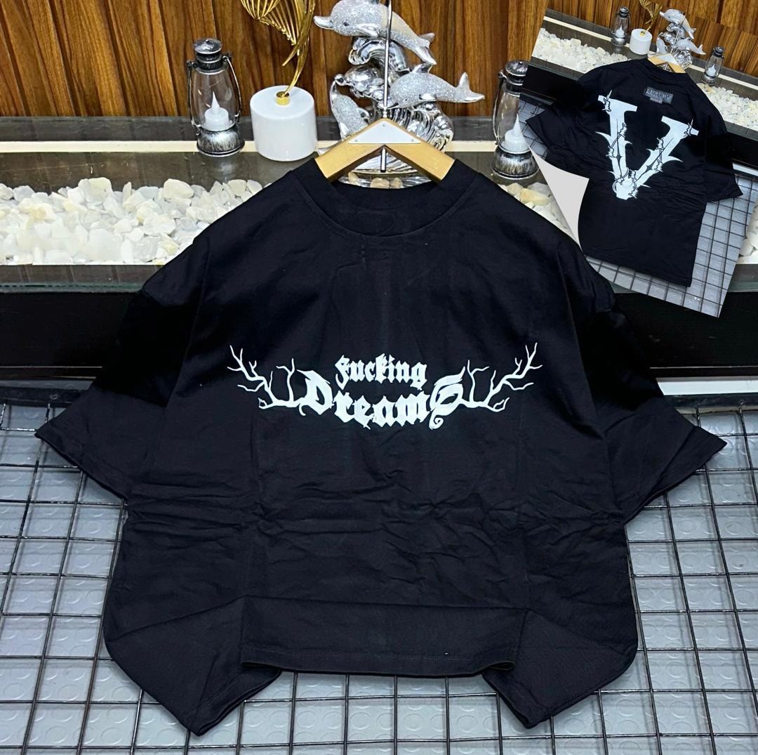 Black oversized t-shirt with white 'fucking Dreams' gothic print on front and inset back V view.