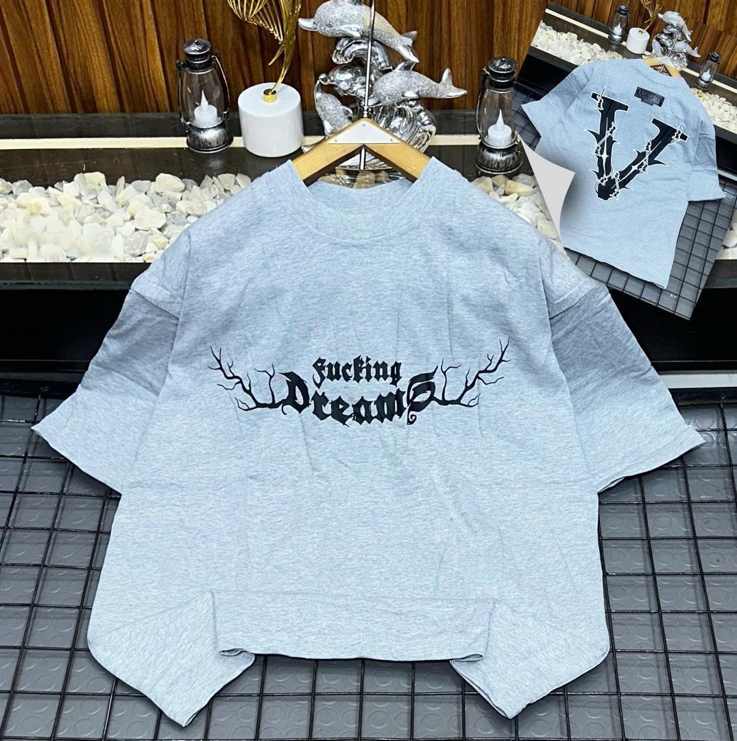 Light gray oversized t-shirt with black 'fucking Dreams' branch print on front and inset back V view.