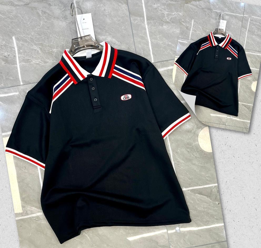 Black polo shirt with red white and blue striped collar and sleeves.