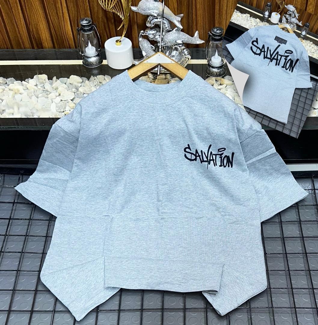 Light gray oversized t-shirt with black Salvation graffiti print on chest and back views.