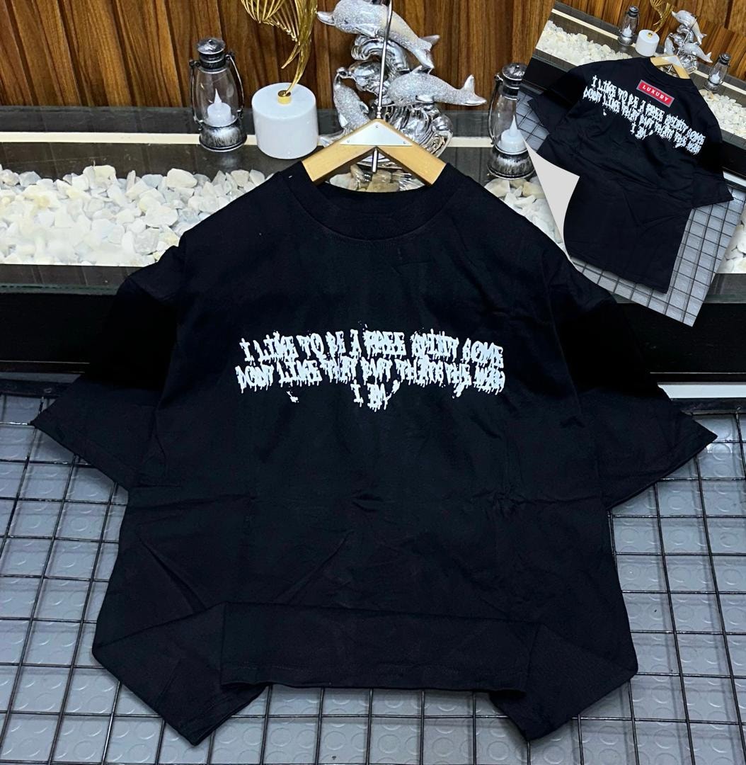 Black oversized t-shirt with white dripping quote print on front and back views.