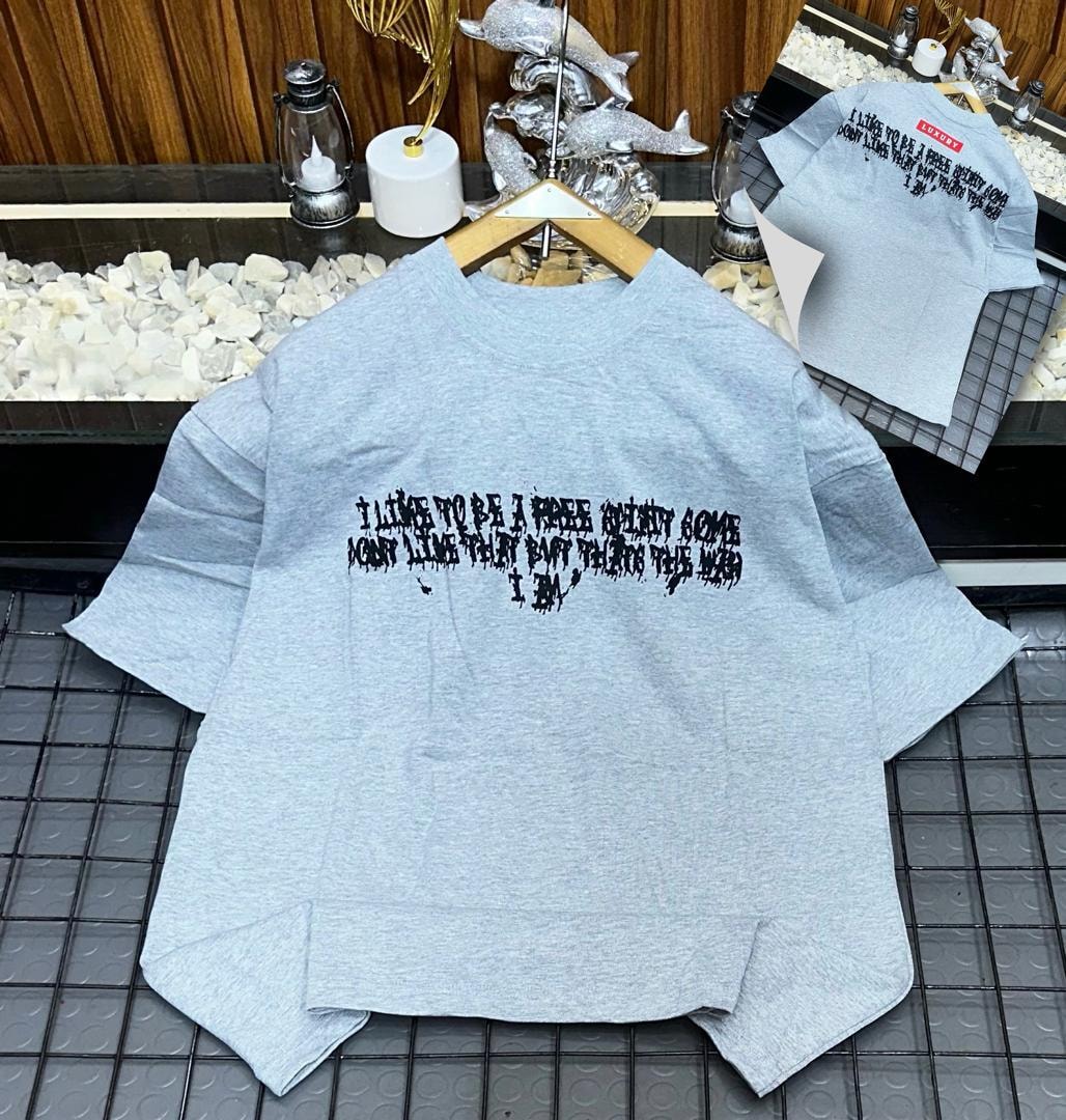 Light gray oversized t-shirt with black dripping quote print on front and back views.