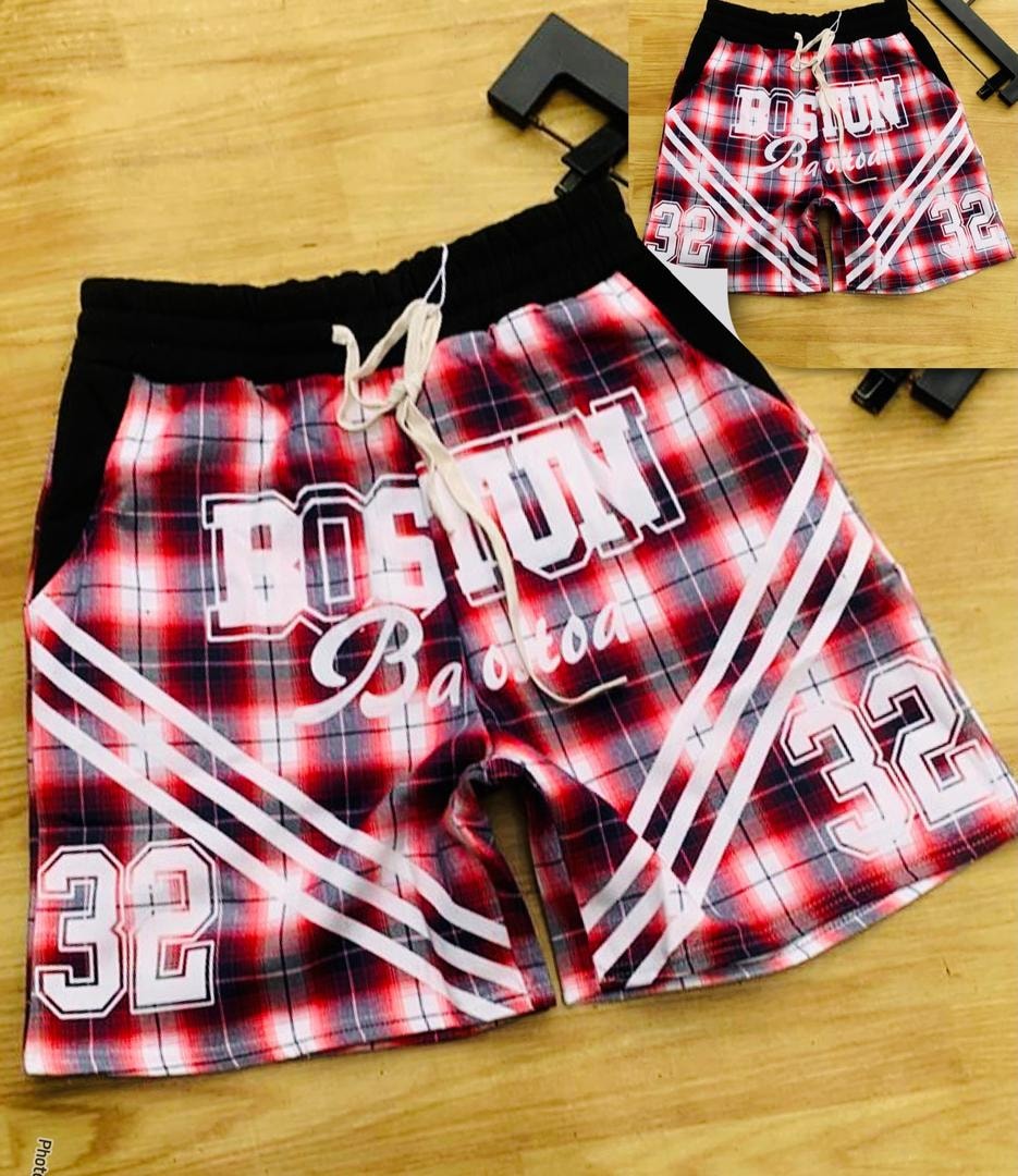 Red plaid Boston print shorts with graphic details and drawstring waist.